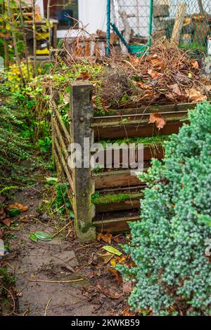 Composter bin in garden - recycling of garden and kitchen waste Stock Photo