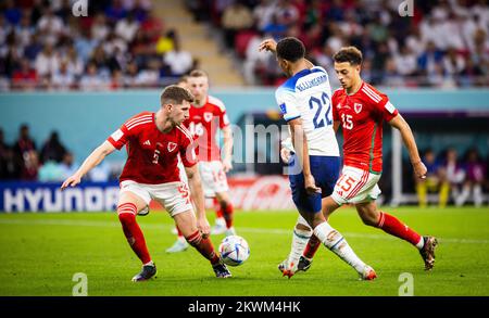 Doha, Qatar. 29th Nov, 2022.  Jude Bellingham (England), Chris Mepham (Wales), Ethan Ampadu (Wales) Wales - England   World Cup 2022 in Qatar 28.11.20 Stock Photo