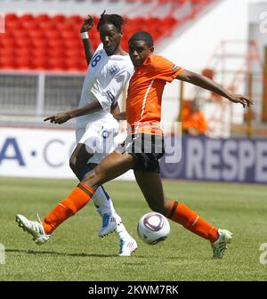 England's Blair Turgott and Netherland's Terence Kongolo. Stock Photo