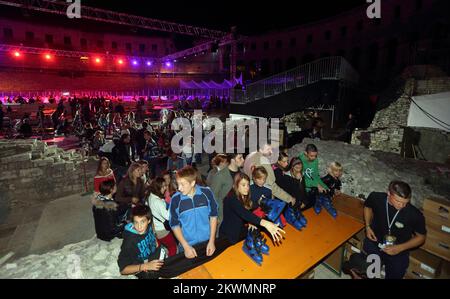 Hockey fans and residents of city Pula  ice skate on hockey filed after an end of second day of Arena Ice Fever MMXII in roman amphitheatre on 15. september 2012.  Organizers are ensure 500 skates everyone who wants ice skate  Photo: Zeljko Lukunic/PIXSELL Stock Photo