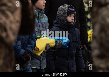 Lviv, Ukraine, Ukraine. 29th Nov, 2022. Oleg Bervetskyi, 39, was killed on November 21, 2022, in combat after a recent visit home for his birthday. His wife, Natalia, and two children said goodbye surrounded by family and friends while air alarms sounded out. He was buried alongside Maksym-Mykhailo Vrubel at Lychakiv cemetery after a service at the Garrison Church of Saints Apostles Peter and Paul in Lviv, Ukraine on November 29, 2022. (Credit Image: © Svet Jacqueline/ZUMA Press Wire) Stock Photo