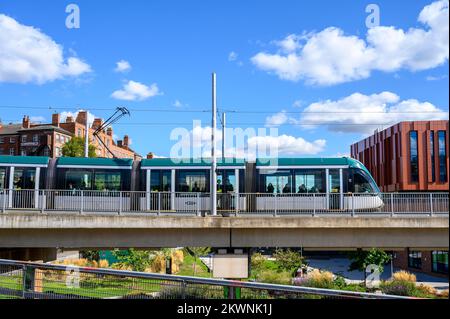 Nottingham Express Transit tram crossing a bridge in Nottingham city centre, England. Stock Photo