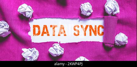 Writing displaying text Data Sync, Business approach data that is continuously generated by different sources Stock Photo