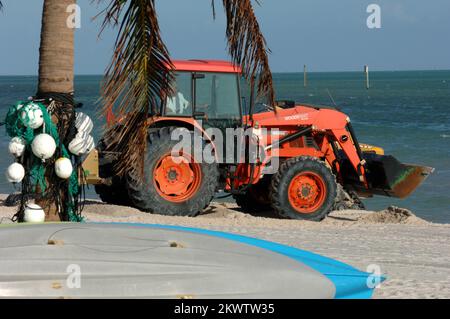 Hurricane Wilma,  Key West, FL, November 4, 2005   A worker moves sand around with a tractor. The city is working to put the sand back in it's proper place following Hurricane Wilma.. Photographs Relating to Disasters and Emergency Management Programs, Activities, and Officials Stock Photo
