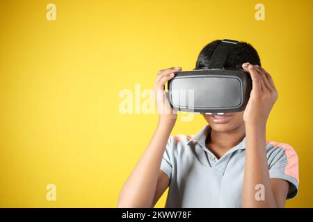 young man wearing virtual reality headset, vr box. Stock Photo