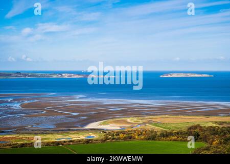 High view across Lavan Sands (Traeth Lafan) mudflats and Menai Strait to Isle of Anglesey and Puffin Island. Abergwyngregyn, Gwynedd, north Wales, UK Stock Photo