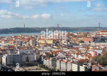 Aerial view of Lisbon with 25 de Abril Bridge and Sanctuary of Christ the King on background - Lisbon, Portugal Stock Photo