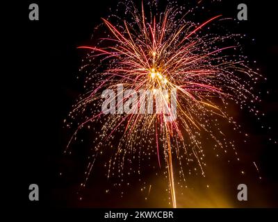 Fireworks in the black night sky Stock Photo