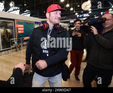 UFC Heavyweight Champion Stipe Miocic, orange jersey, waves Ohio's