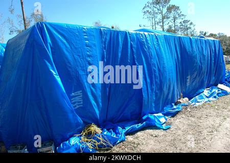 Severe Storms and Tornadoes,  Lady Lake, Fla., February 6, 2007   A blue tarp covers this manufactured home damaged by the recent central Florida tornadoes. Tornadoes are a very powerful and destructive force. Mark Wolfe/FEMA.. Photographs Relating to Disasters and Emergency Management Programs, Activities, and Officials Stock Photo