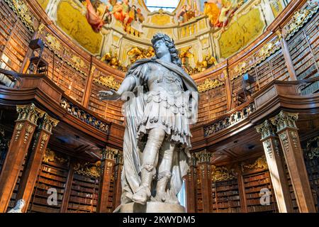 Emperor Charles VI as “Hercules Musarum” The State Hall's statues in the Prunksaal library or Austrian National Library, Austria, Vienna.   The larger Stock Photo