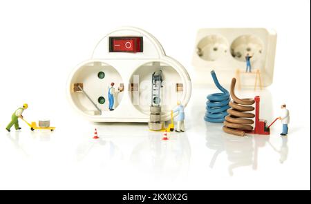 electricity work through miniatures as a concept for an electricity shop Stock Photo