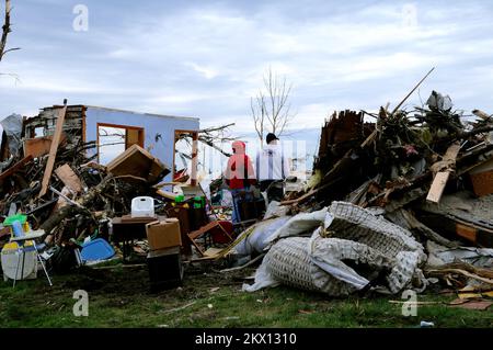 Severe Storms, Tornadoes, and Flooding,  Parkersburg, IA, May 28, 2008   A couple stands in the debris of their home in Parkersburg, Iowa. The kitchen wall and the family. Barry Bahler/FEMA.. Photographs Relating to Disasters and Emergency Management Programs, Activities, and Officials Stock Photo