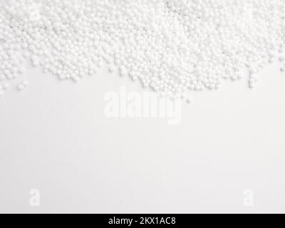 Polystyrene balls as insulation material or filling on a white background Stock Photo