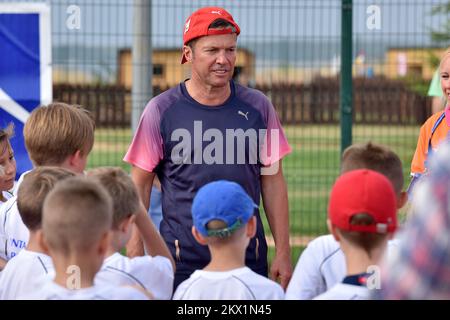 24.07.2017., Petrcane, Croatia - Former German football star Lothar Matthaus during his vocation organized a small football school for children and teenagers, where he gave the kids a cue. Photo: Dino Stanin/PIXSELL  Stock Photo