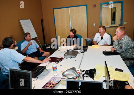 Hurricane Dolly,  South Padre Island,TX, July 26, 2008   (L-R) Frank Cantu, Texas State Coordinating Officer (SCO); Robert N. Pinkerton,Jr., Mayor; Sandy Cashman, FEMA Federal Coordinating Officer (FCO); Burney Baskett, City Fire Chief/Emergency Management Coordinator; Lt. Col. Travis Grigg, US Army North, DOD Coordinating Officer, discuss the recovery status on the Island. Barry Bahler/FEMA.. Photographs Relating to Disasters and Emergency Management Programs, Activities, and Officials Stock Photo