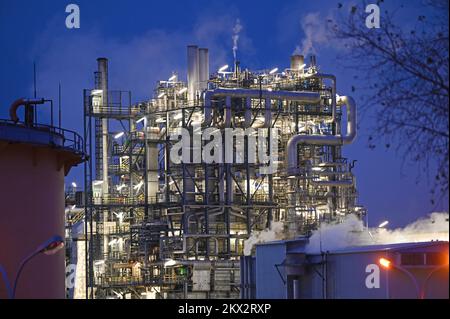 Illuminated OMV refinery in Schwechat, Lower Austria, at night Stock Photo