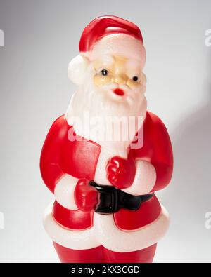 Plastic blow mold Santa figurine on white background. Stock Photo