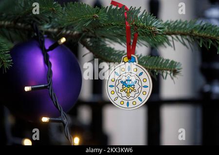 Bauble on the Christmas tree in Downing Street that Olena Zelenska, First Lady of Ukraine, hung in support of the people of Ukraine. Stock Photo