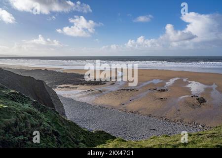 Low sunshine over Sandymouth beach in Cornwall West Country Stock Photo