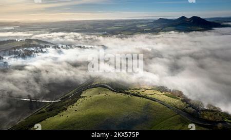Aerial view of a cloud inversion around the Eildons and the River Tweed ...