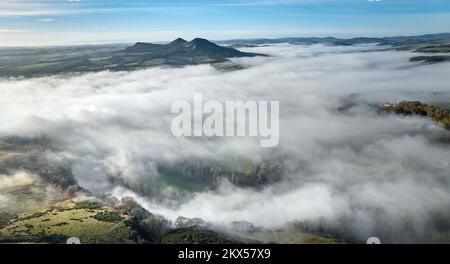 Aerial view of a cloud inversion around the Eildons and the River Tweed ...