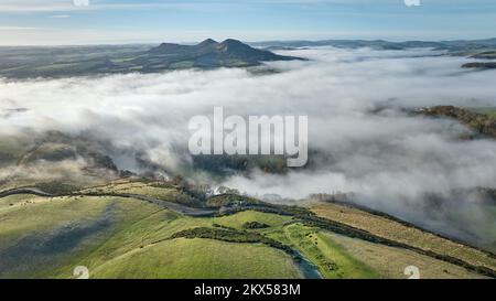 Aerial view of a cloud inversion around the Eildons and the River Tweed ...