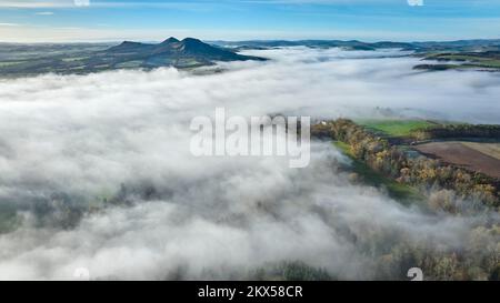 Aerial view of a cloud inversion around the Eildons and the River Tweed ...