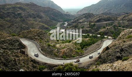 The Khyber Pass in northern Pakistan. Vehicles are climbing the Khyber Pass on the Pakistan side heading towards Afghanistan. Stock Photo