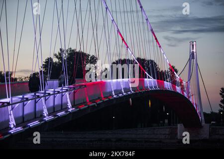13.07.2018., Osijek, Croatia - Pedestrian Bridge over the river Drava illuminated in the colors of Croatian chessboard in support of the Croatian national football team at the World Cup Finals. Photo: Davor Javorovic/PIXSELL Stock Photo
