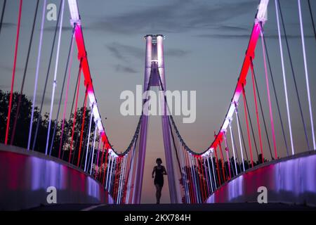 13.07.2018., Osijek, Croatia - Pedestrian Bridge over the river Drava illuminated in the colors of Croatian chessboard in support of the Croatian national football team at the World Cup Finals. Photo: Davor Javorovic/PIXSELL Stock Photo