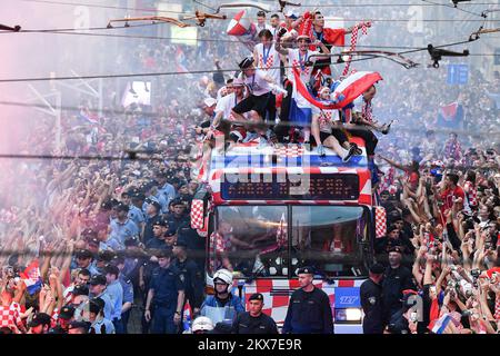 16.07.2018., Zagreb - Welcome home party for Croatian Football Team. Domagoj Vida was the absolute greatest star of the welcome home parade, but at the end of the 'marathon' road from the airport to the center of town which lasted for 6 hours everyone was worried about Domago Vida not falling off the bus. Luka Modric, Danijel Subasic and Sime Vrsaljko are just some of the football players who take care for him. At the end off the road coach Zlatko Dalic had to keep him to the shirt and pants at the same time because Domagoj had slipped off the bus six times. Photo: Sandra Simunovic/PIXSELL Stock Photo