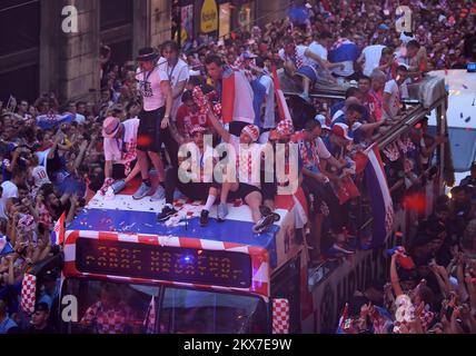 16.07.2018., Zagreb - Welcome home party for Croatian Football Team. Domagoj Vida was the absolute greatest star of the welcome home parade, but at the end of the 'marathon' road from the airport to the center of town which lasted for 6 hours everyone was worried about Domago Vida not falling off the bus. Luka Modric, Danijel Subasic and Sime Vrsaljko are just some of the football players who take care for him. At the end off the road coach Zlatko Dalic had to keep him to the shirt and pants at the same time because Domagoj had slipped off the bus six times. Photo: Marko Lukunic/PIXSELL Stock Photo
