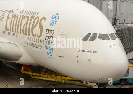 HONG KONG - MARCH 09, 2015: docked Emirates Airbus A380. Emirates handles major part of passenger traffic and aircraft movements at the airport. Stock Photo