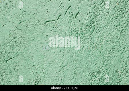 Wall painted with light green paint with bumps Stock Photo