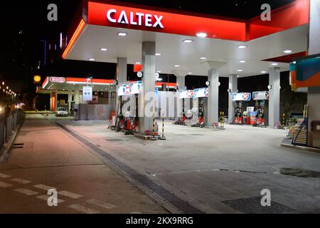 HONG KONG - APRIL 15, 2015: Caltex fuel station at evening. Caltex is a petroleum brand name of Chevron Corporation used in more than 60 countries in Stock Photo