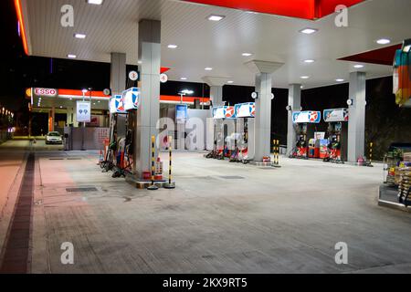 HONG KONG - APRIL 15, 2015: Caltex fuel station at evening. Caltex is a petroleum brand name of Chevron Corporation used in more than 60 countries in Stock Photo