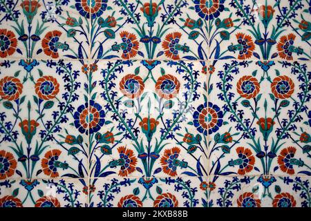 Seamless pattern white Turkish tiles with blue ornaments. Old surface texture, wall in mosque Stock Photo