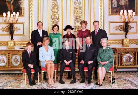 File photo dated 09/03/1997 of the Royal Family in the White drawing room of Windsor Castle, on the day of Prince William's Confirmation. (L/R front) Prince Harry, Diana, Princess of Wales, Prince William, The Prince of Wales and The Queen. (L/R back) King Constantine, Lady Susan Hussey, Princess Alexandra, the Duchess of Westminster and Lord Romsey. Lady Susan Hussey, a member of the Buckingham Palace household has resigned and apologised after she made 'unacceptable and deeply regrettable comments' by asking Ngozi Fulani, a prominent black advocate for survivors of domestic abuse where she ' Stock Photo