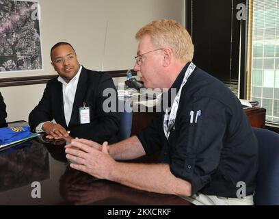 Tornado - Birmingham, Ala. , May 13, 2011   Federal Coordinating Officer (FCO) Mike Byrne,(right) and Small Business Administration Regional Administrator Cassius Butts have a meeting to discuss operations in Alabama. FEMA and the SBA are partners in helping survivors recover from disasters. FEMA photo / Tim Burkitt. Alabama Severe Storms, Tornadoes, Straight-line Winds, and Flooding. Photographs Relating to Disasters and Emergency Management Programs, Activities, and Officials Stock Photo