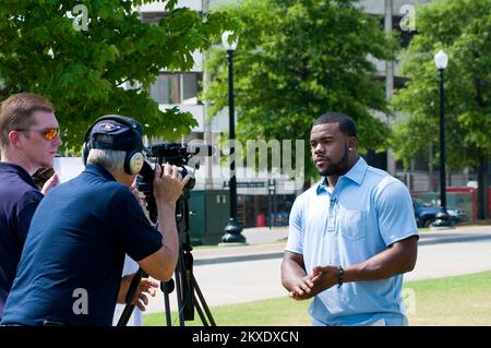 Tornado - Tuscaloosa, Ala. , June 11, 2011   University of Alabama Heisman Trophy winner and New Orleans Saints running back Mark Ingram shoots a video for FEMA. Mark came back to Tuscaloosa for the first time since the tornado to help FEMA community relations specialists meet with volunteers and survivors. FEMA photo/Tim Burkitt. Alabama Severe Storms, Tornadoes, Straight-line Winds, and Flooding. Photographs Relating to Disasters and Emergency Management Programs, Activities, and Officials Stock Photo