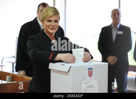 05.01.2020., Croatia, Zagreb - Croatian President Kolinda Grabar Kitarovic accompanied by her husband Jakov, voted in the second round of presidential elections. Elections for the Croatian president continued to a second round or runoff, because none of the 11 candidates received the required majority in the first election, which was held on Sunday December 22, 2019. The candidate who receives the highest number of votes in this round will win the election. Croatians choose between current president Kolinda Grabar-Kitarovic the candidate for the ruling conservative Croatian Democratic Union ( Stock Photo