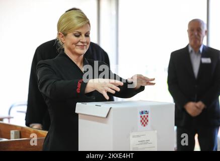 05.01.2020., Croatia, Zagreb - Croatian President Kolinda Grabar Kitarovic accompanied by her husband Jakov, voted in the second round of presidential elections. Elections for the Croatian president continued to a second round or runoff, because none of the 11 candidates received the required majority in the first election, which was held on Sunday December 22, 2019. The candidate who receives the highest number of votes in this round will win the election. Croatians choose between current president Kolinda Grabar-Kitarovic the candidate for the ruling conservative Croatian Democratic Union ( Stock Photo