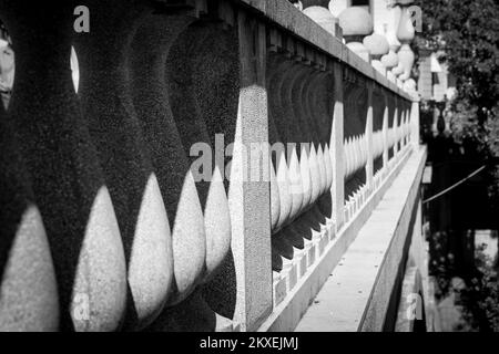 The contrast black and white detail of the columns of the banister on the old bridge in Ljubljana in Slovenia. Stock Photo