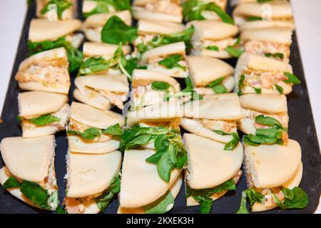 Tray of mini sandwiches for a cocktail. Stock Photo