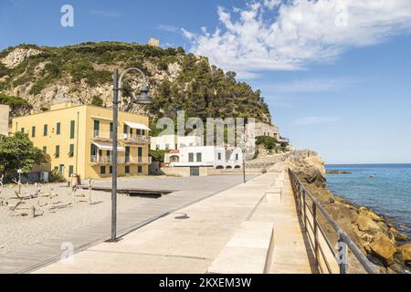 Varigotti, Italy - 10-07-2021: The promenade of Varigotti, with houses with colored facades Stock Photo