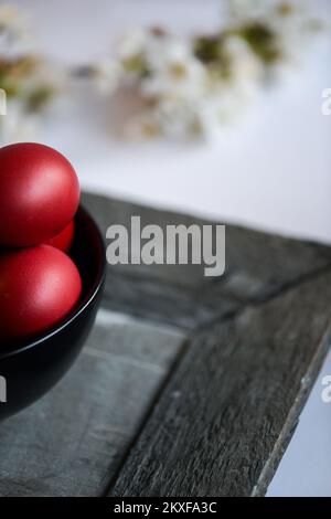 Easter eggs in small bowls. Stock Photo