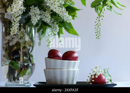 Easter eggs in small bowls. Stock Photo