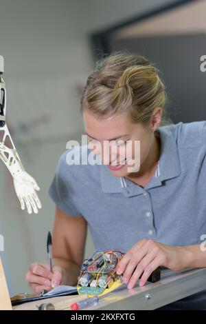 a female robotic electrician smiling Stock Photo