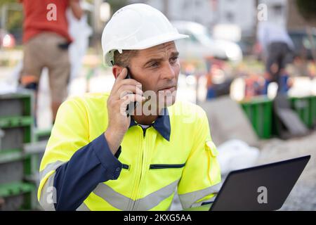 architect supervising a construction outdoords Stock Photo